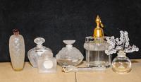 Seven French Molded and Frosted Glass Perfume Articles Height of atomizer 6 3/4 inches.