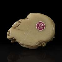 A Chinese carved soapstone figure of a seated Budai 寿山石雕布袋和尚