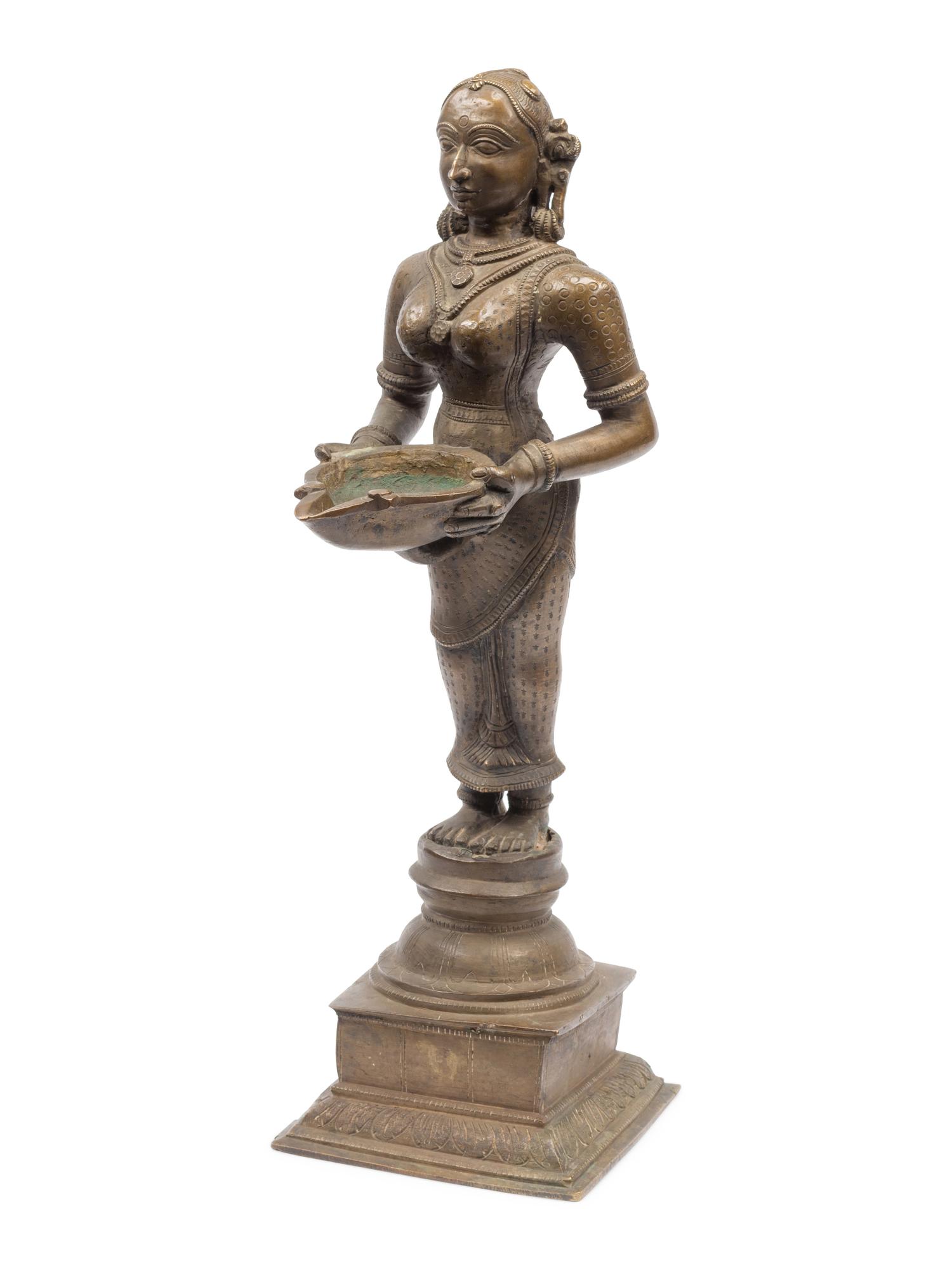 An Indian Patinated Metal Figure of a Standing Deity