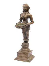 An Indian Patinated Metal Figure of a Standing Deity