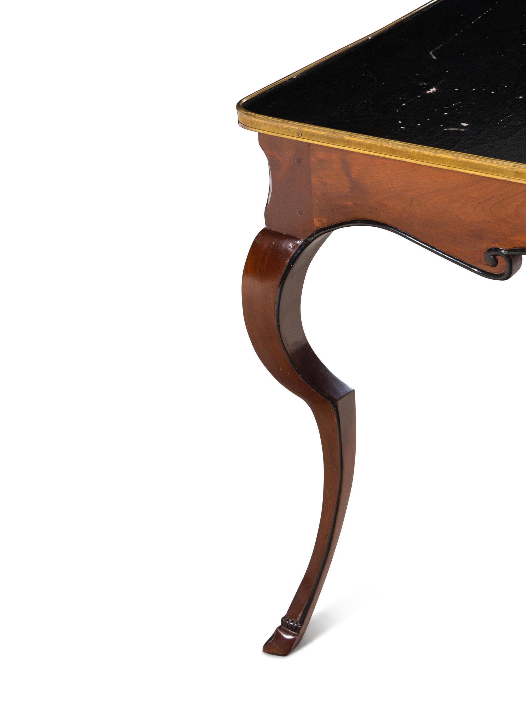 A French Gilt Metal Mounted Parcel Ebonized Mahogany Game Table