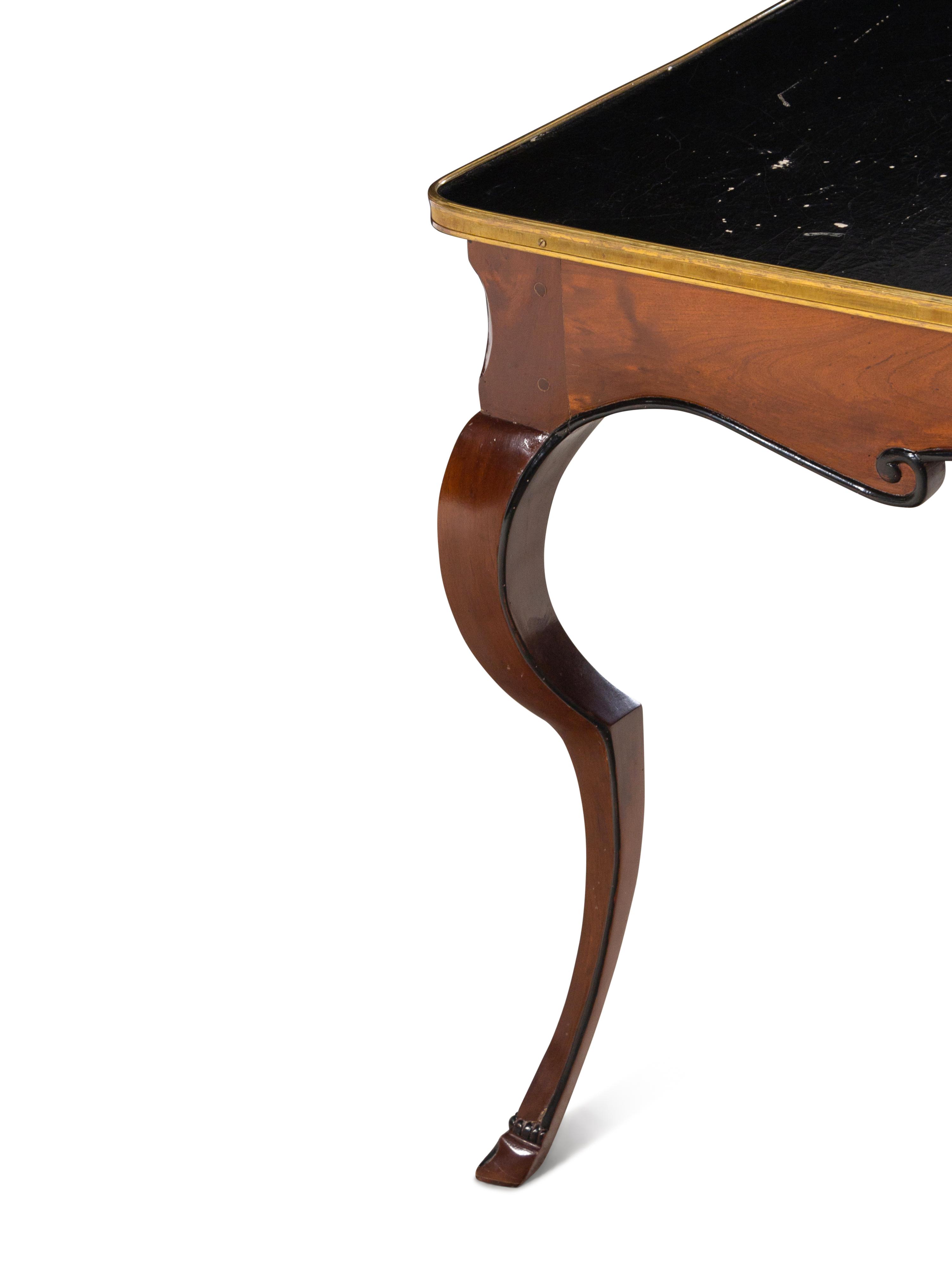 A French Gilt Metal Mounted Parcel Ebonized Mahogany Game Table