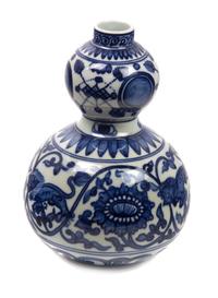 A Chinese Blue and White Porcelain Gourd Form Vase Height 8 1/4 inches.