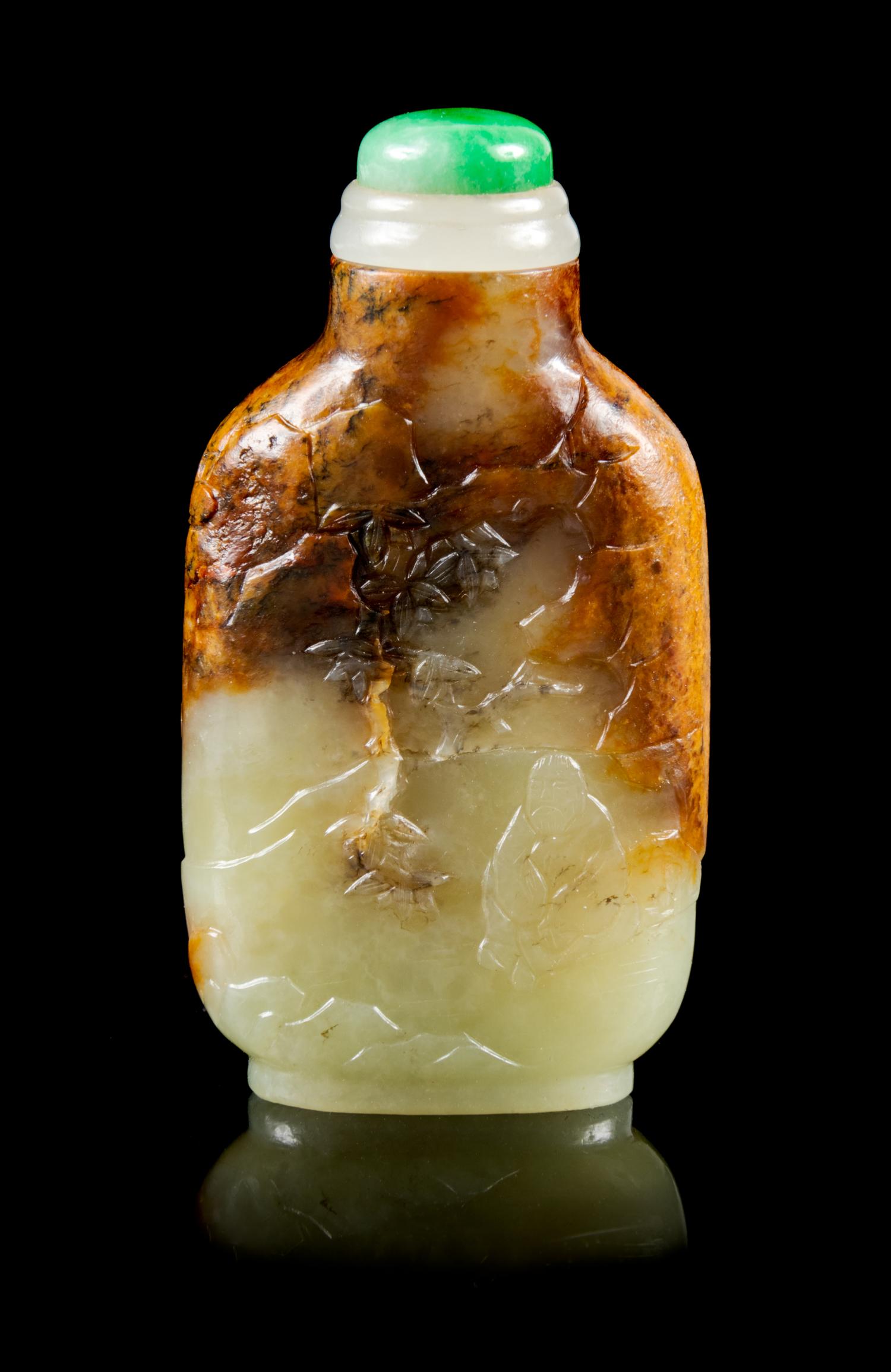 A Carved Celadon and Russet Jade Snuff Bottle Height 2 3/8 inches. — MASTER OF THE ROCKS SCHOOL, 1740-1840