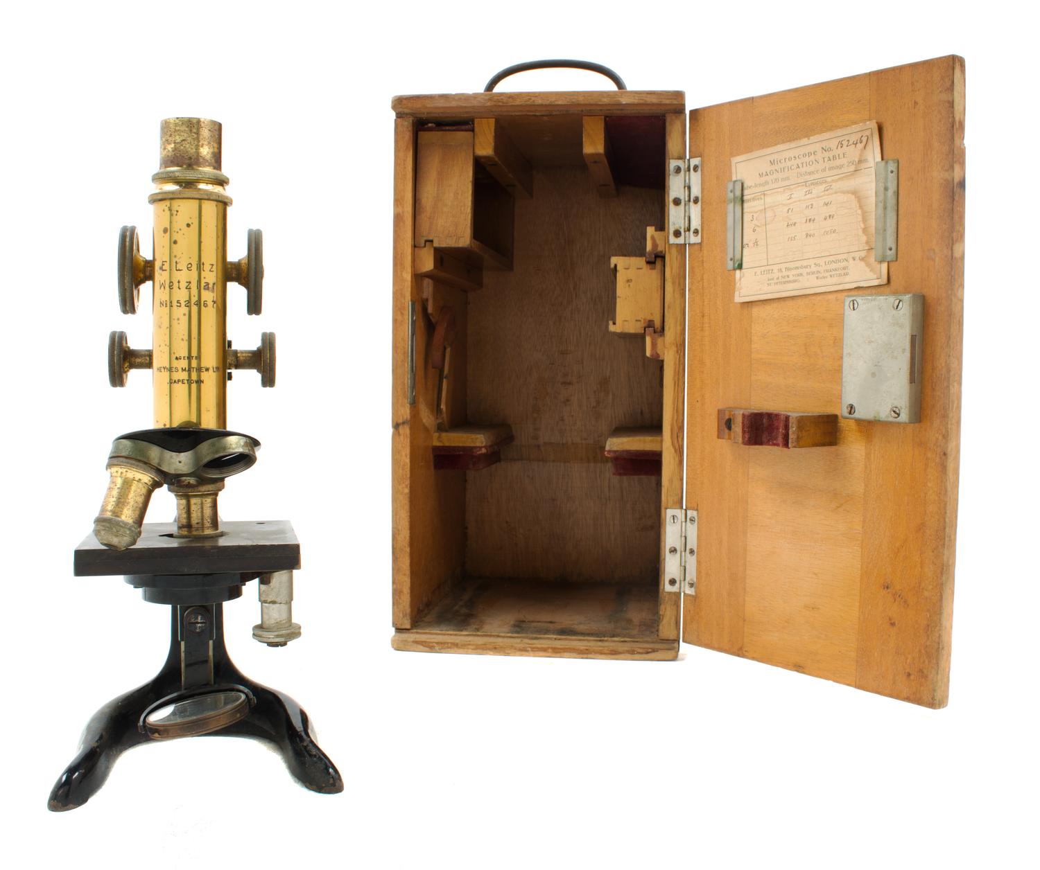 A German Brass and Black Lacquered Microscope Height 10 3/4 inches. — LEITZ, RETAILED BY LYNES MATHEWS, CAPETOWN, EARLY 20TH CENTURY