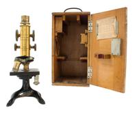 A German Brass and Black Lacquered Microscope Height 10 3/4 inches. — LEITZ, RETAILED BY LYNES MATHEWS, CAPETOWN, EARLY 20TH CENTURY