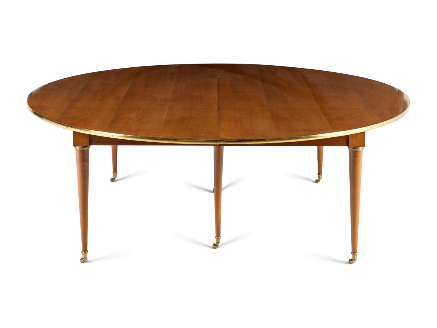 A Directoire Style Brass Mounted Walnut Dining Table