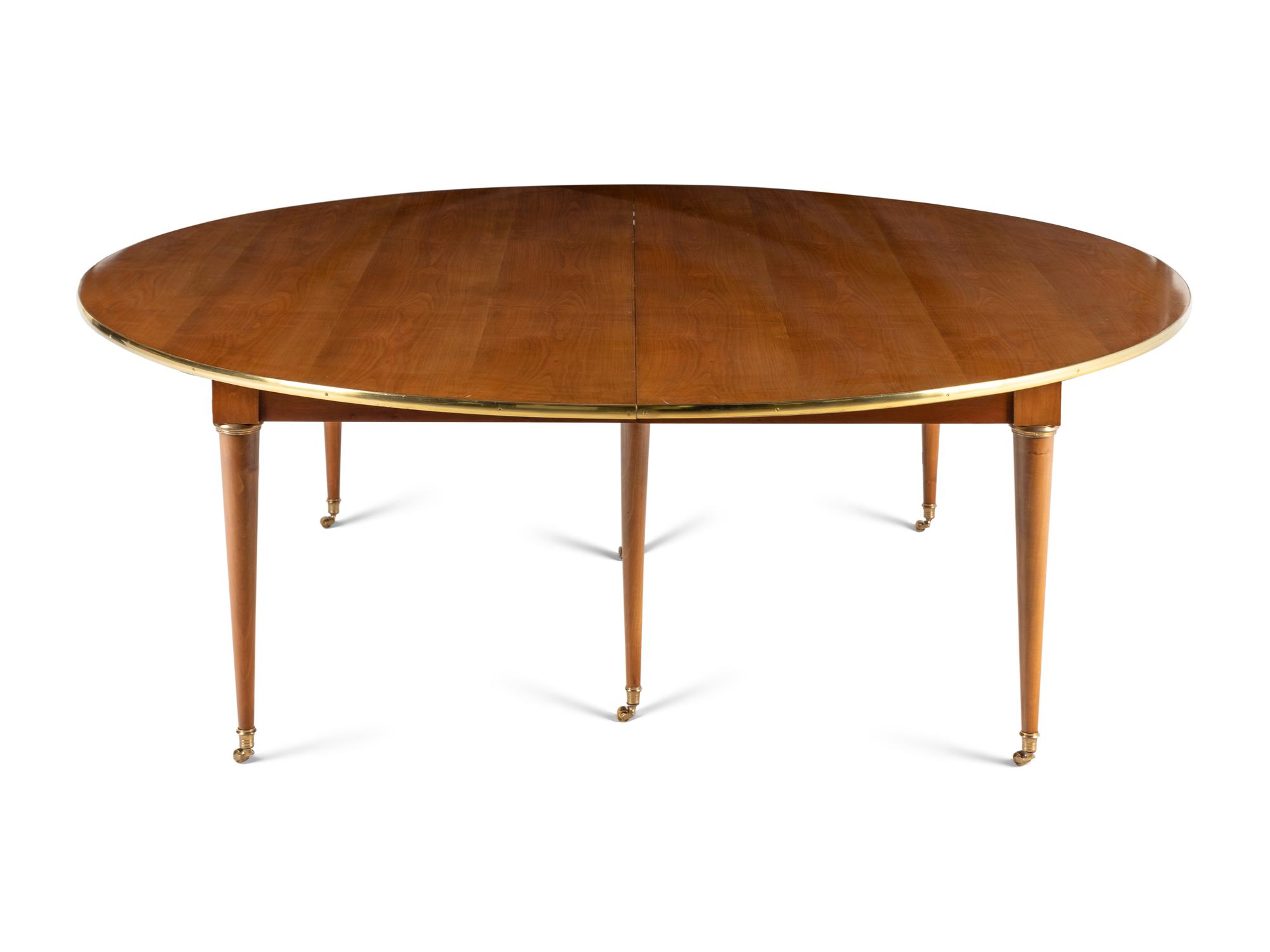 A Directoire Style Brass Mounted Walnut Dining Table