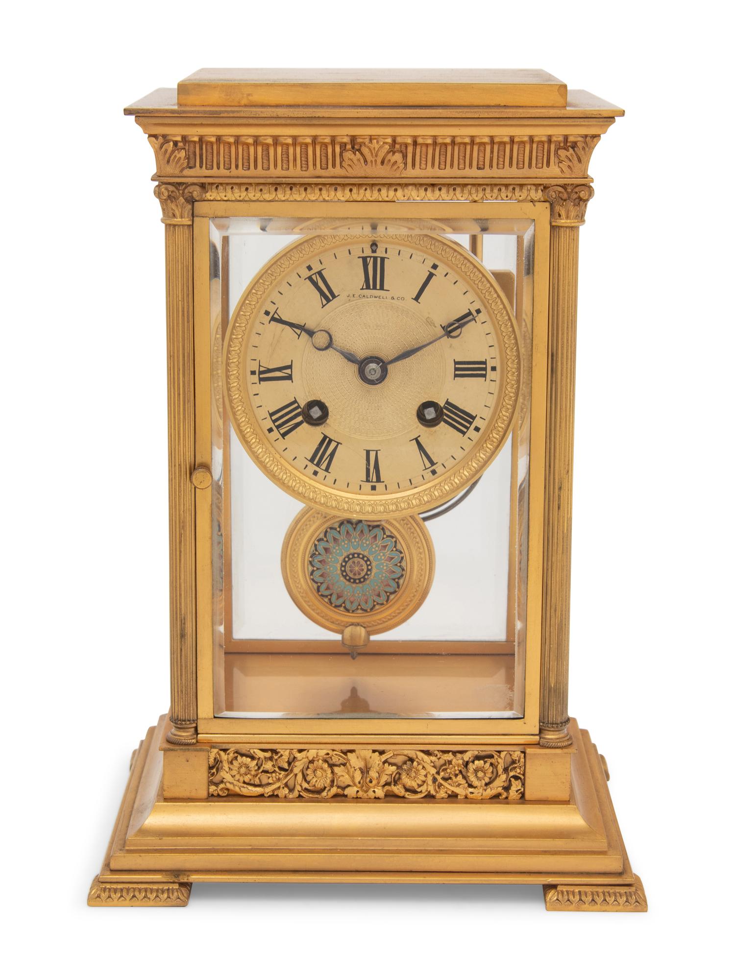 A Continental Gilt Bronze and Champlevé Mantel Clock