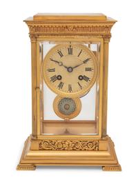 A Continental Gilt Bronze and Champlevé Mantel Clock
