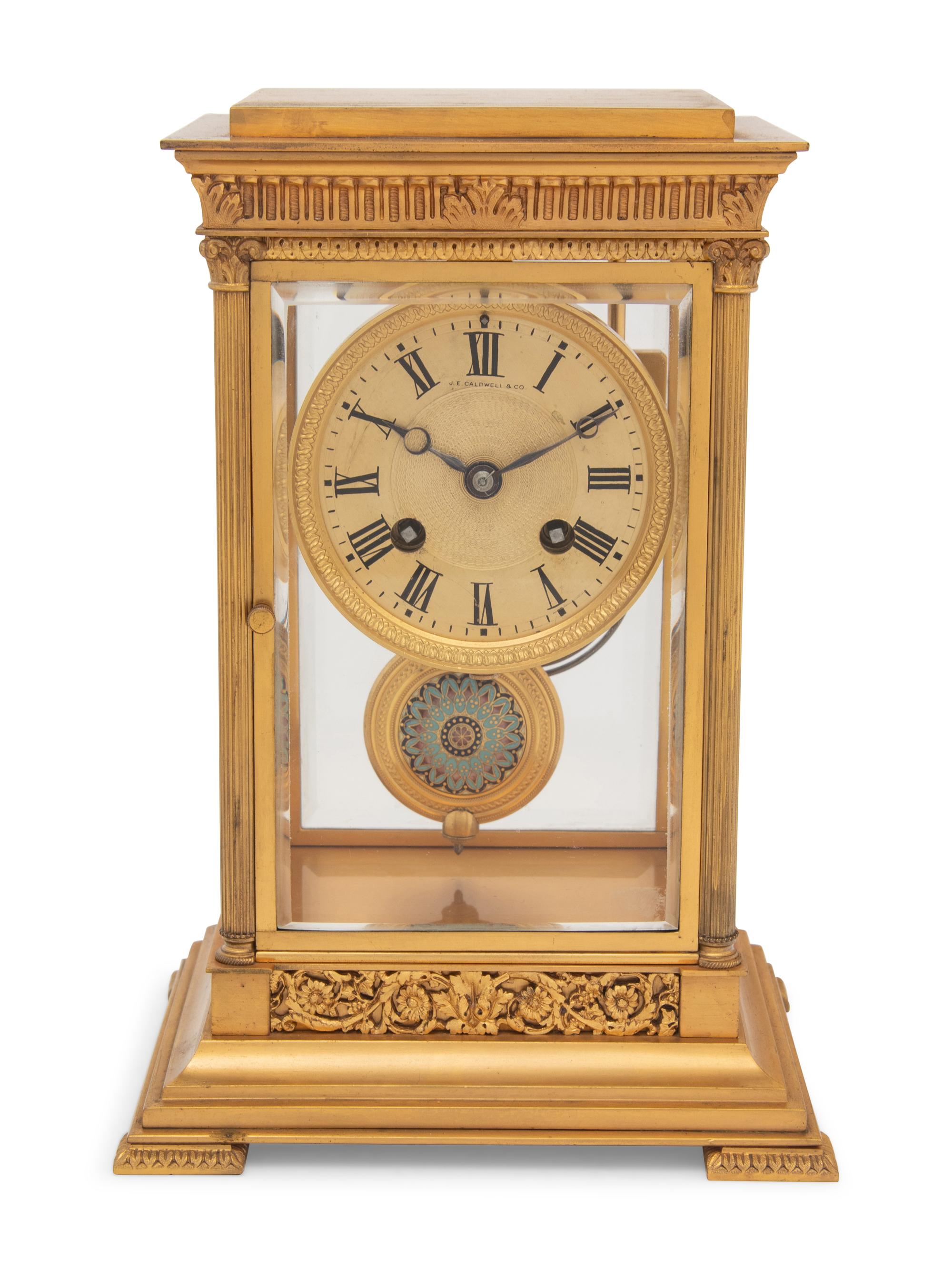 A Continental Gilt Bronze and Champlevé Mantel Clock