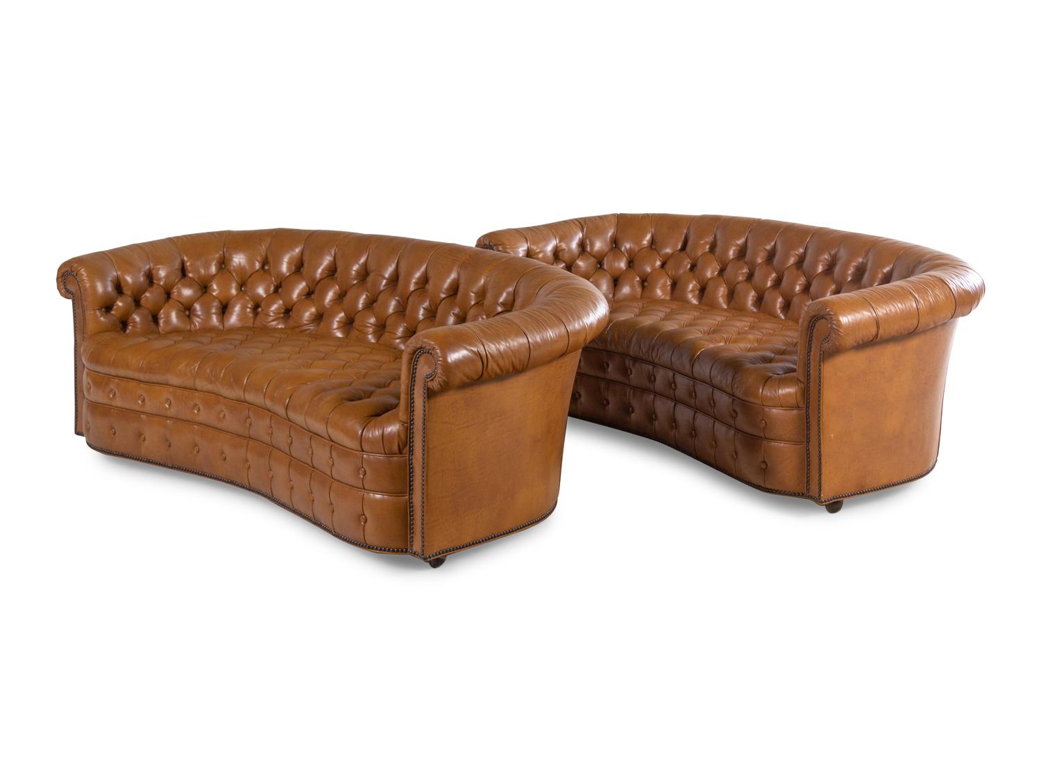 A Pair of Faux Leather Upholstered Chesterfield Sofas