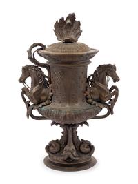 A Continental Cast Metal Urn with Putti and Hippocampi