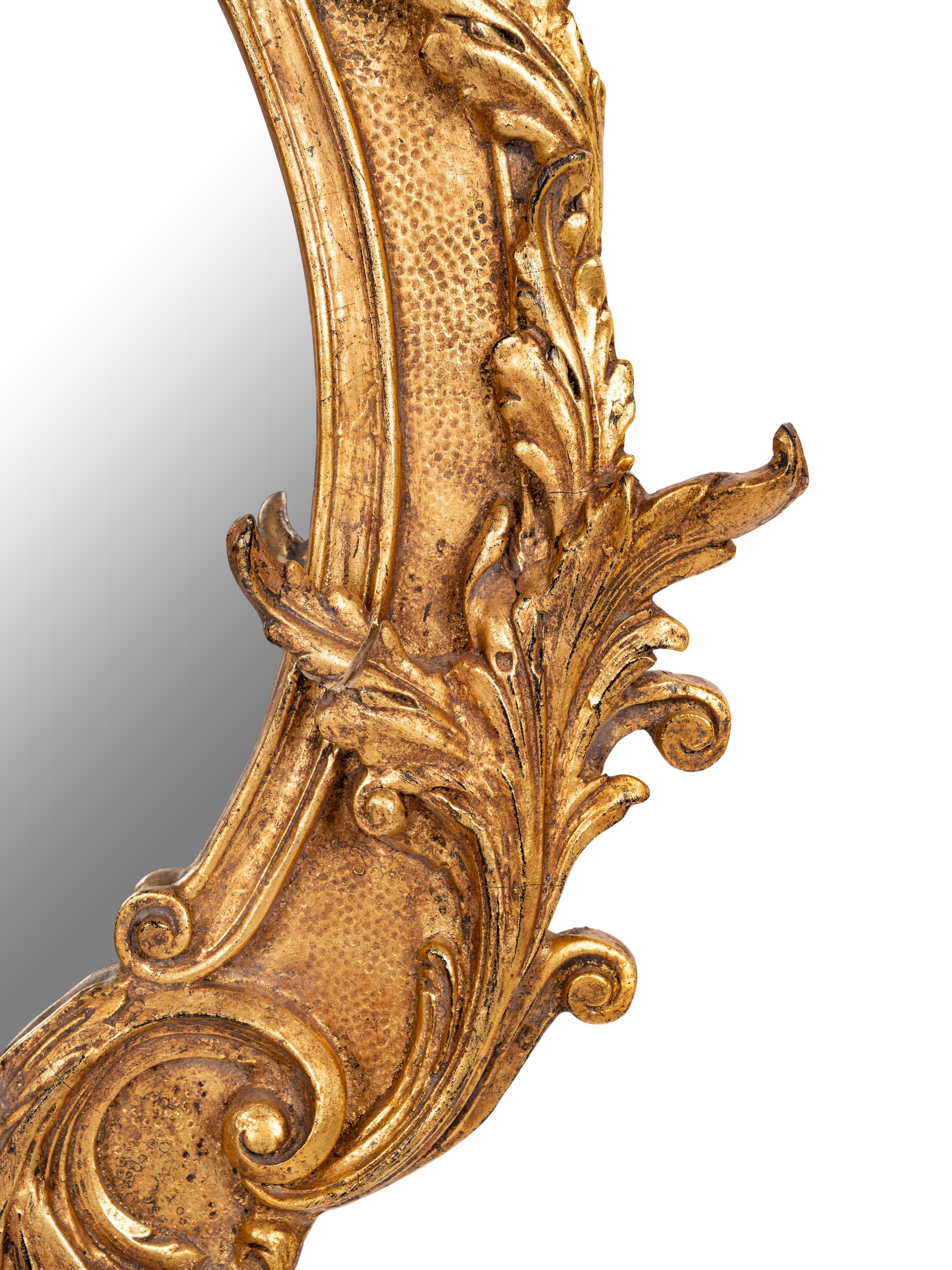 A Baroque Style Giltwood Mirror