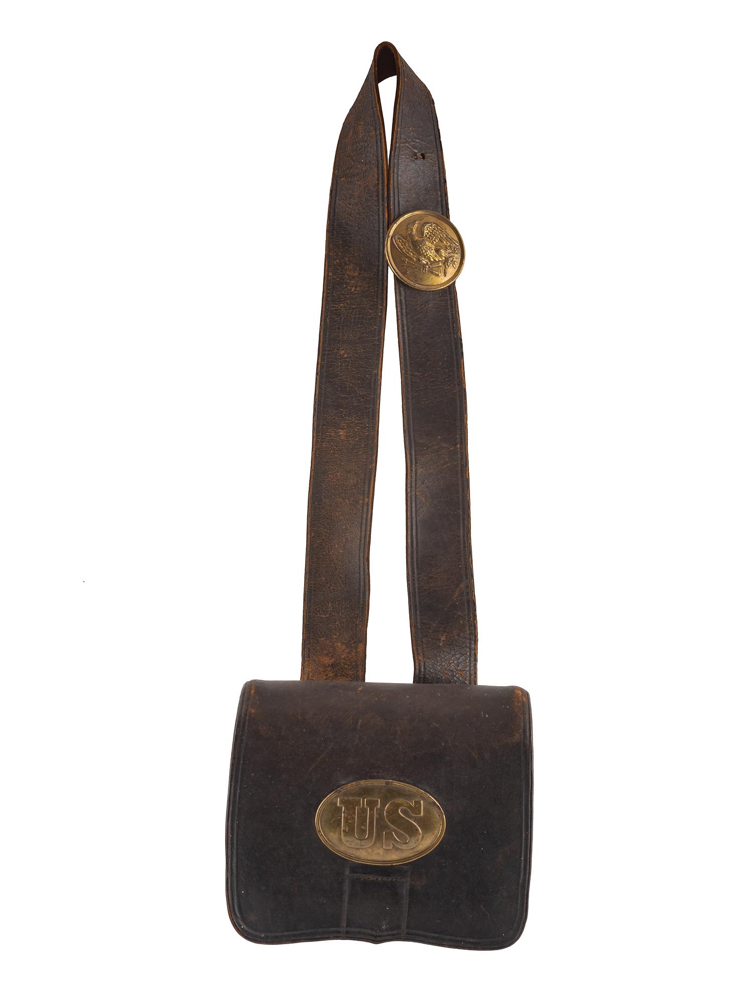 [CIVIL WAR]. A collection of items attributed to Thomas W. Johnson, Co. K, 4th Delaware Infantry, incl. frock coat, cap, belt rig, and cartridge box.