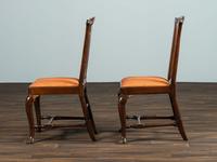 A Set of Six Queen Anne Pierce Carved Mahogany Stretcher Base and Trifid Foot Side Chairs