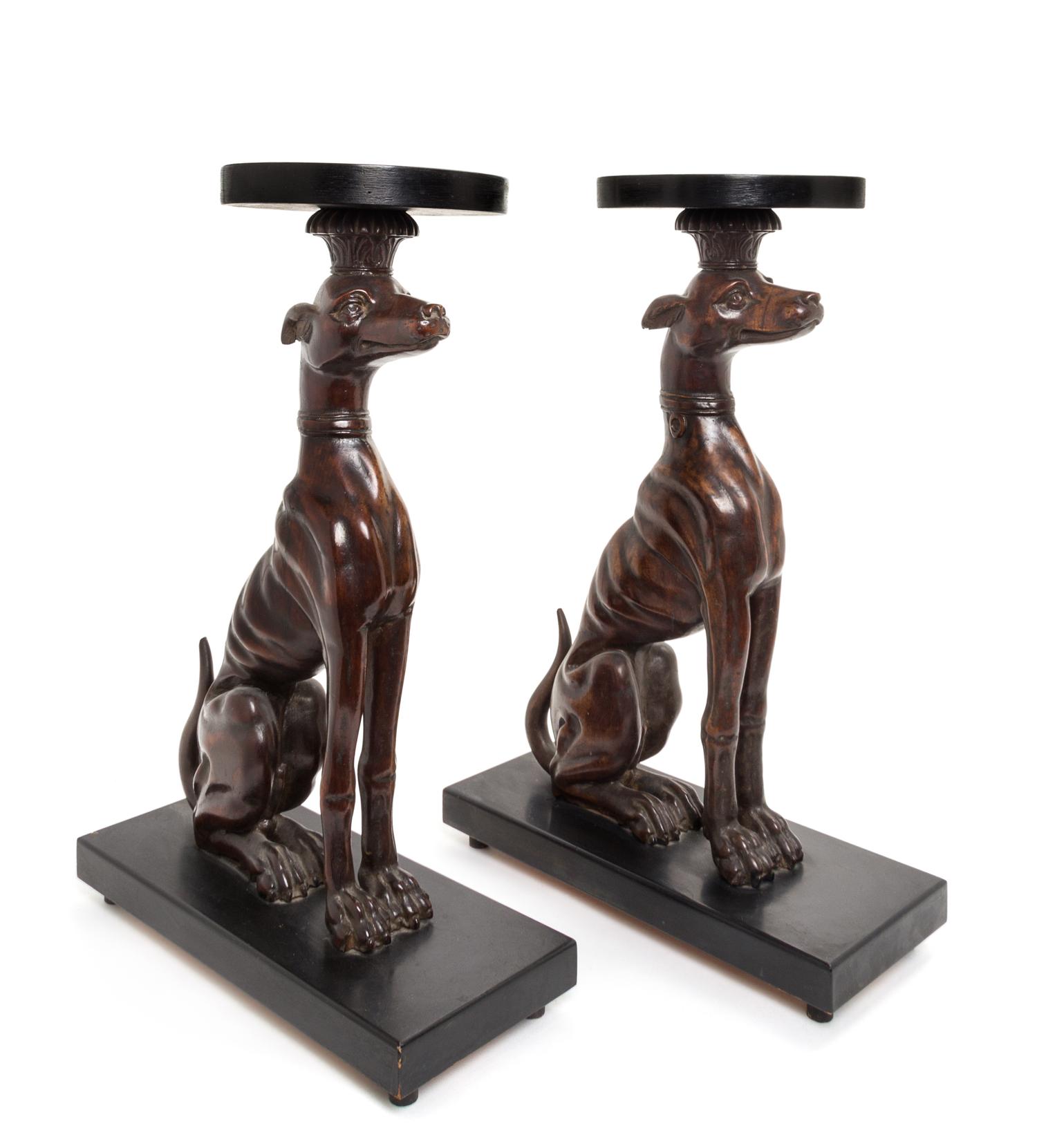 A Pair of Mahogany and Ebonized Whippet Stands Height 23 5/8 inches.