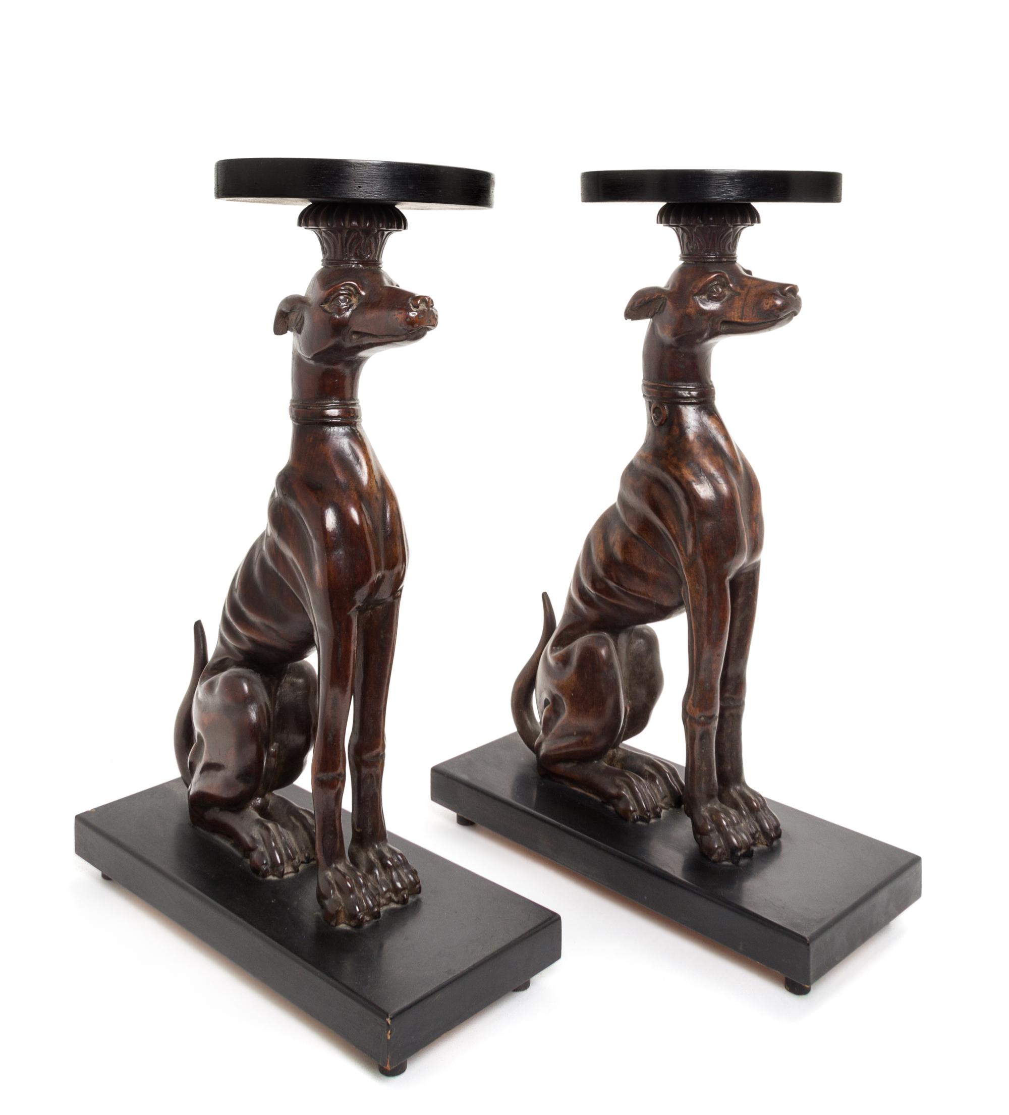 A Pair of Mahogany and Ebonized Whippet Stands Height 23 5/8 inches.