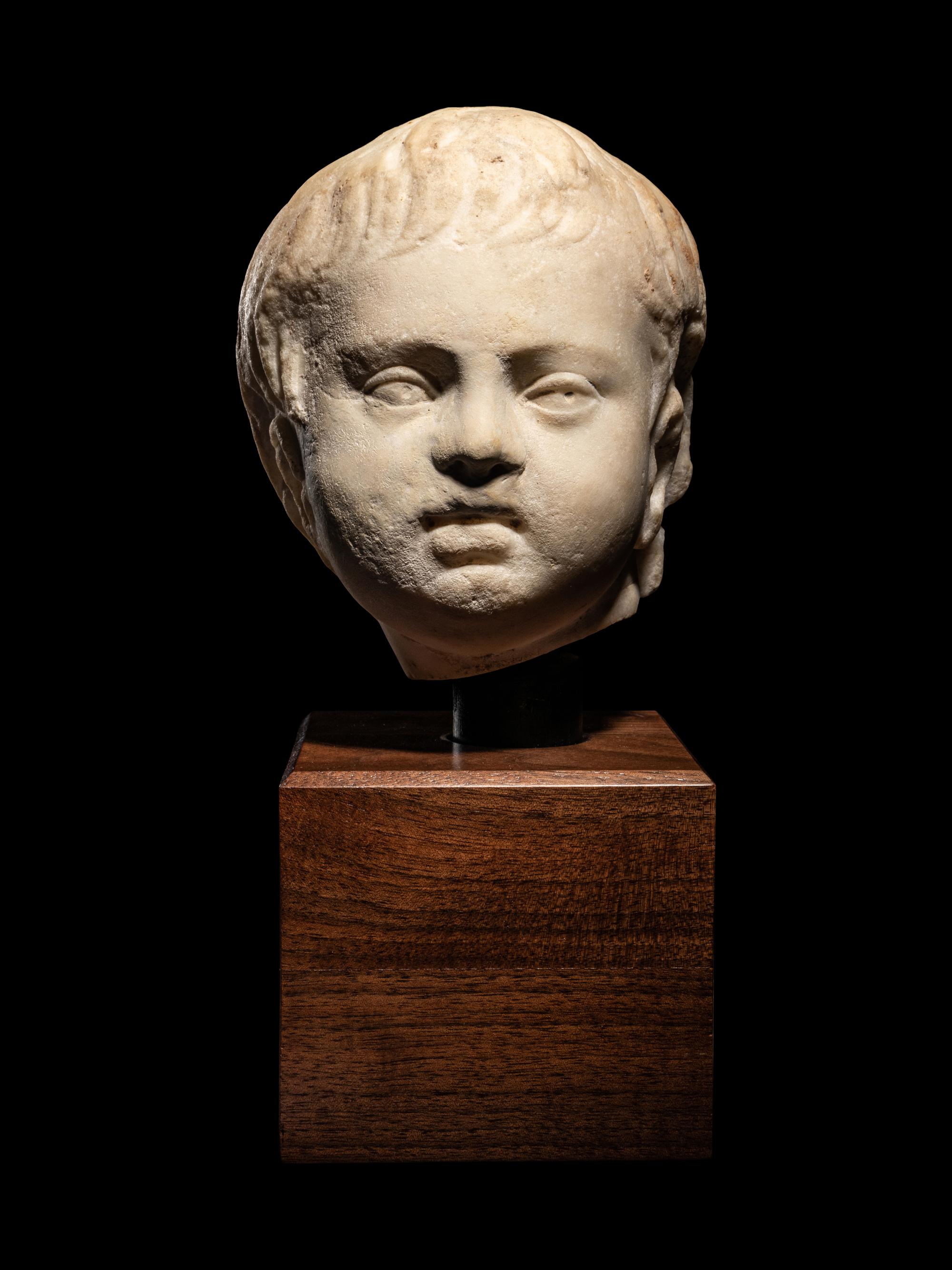 A Roman Marble Portrait Head of Eros
