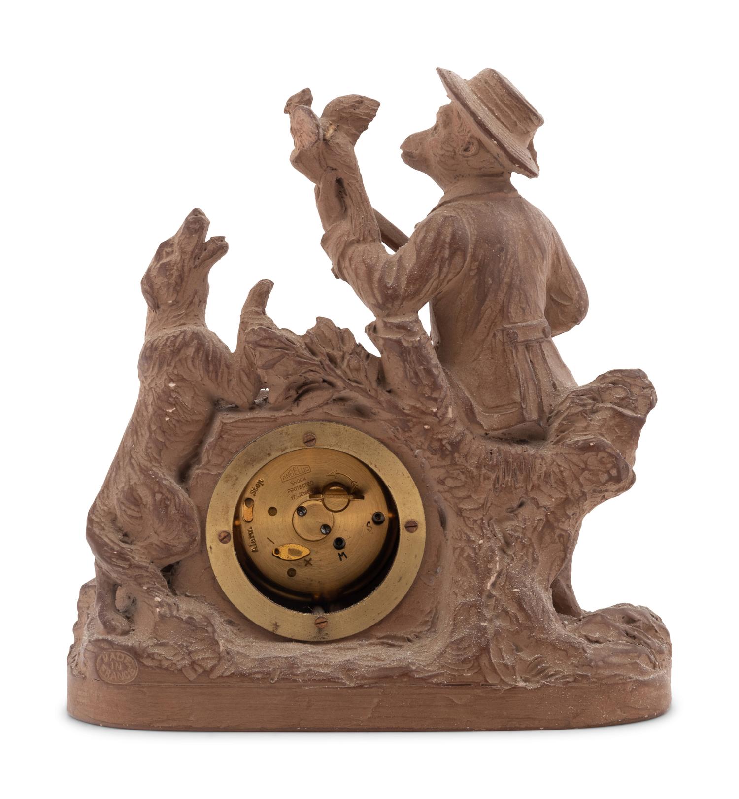 A Continental Terra Cotta Figural Clock