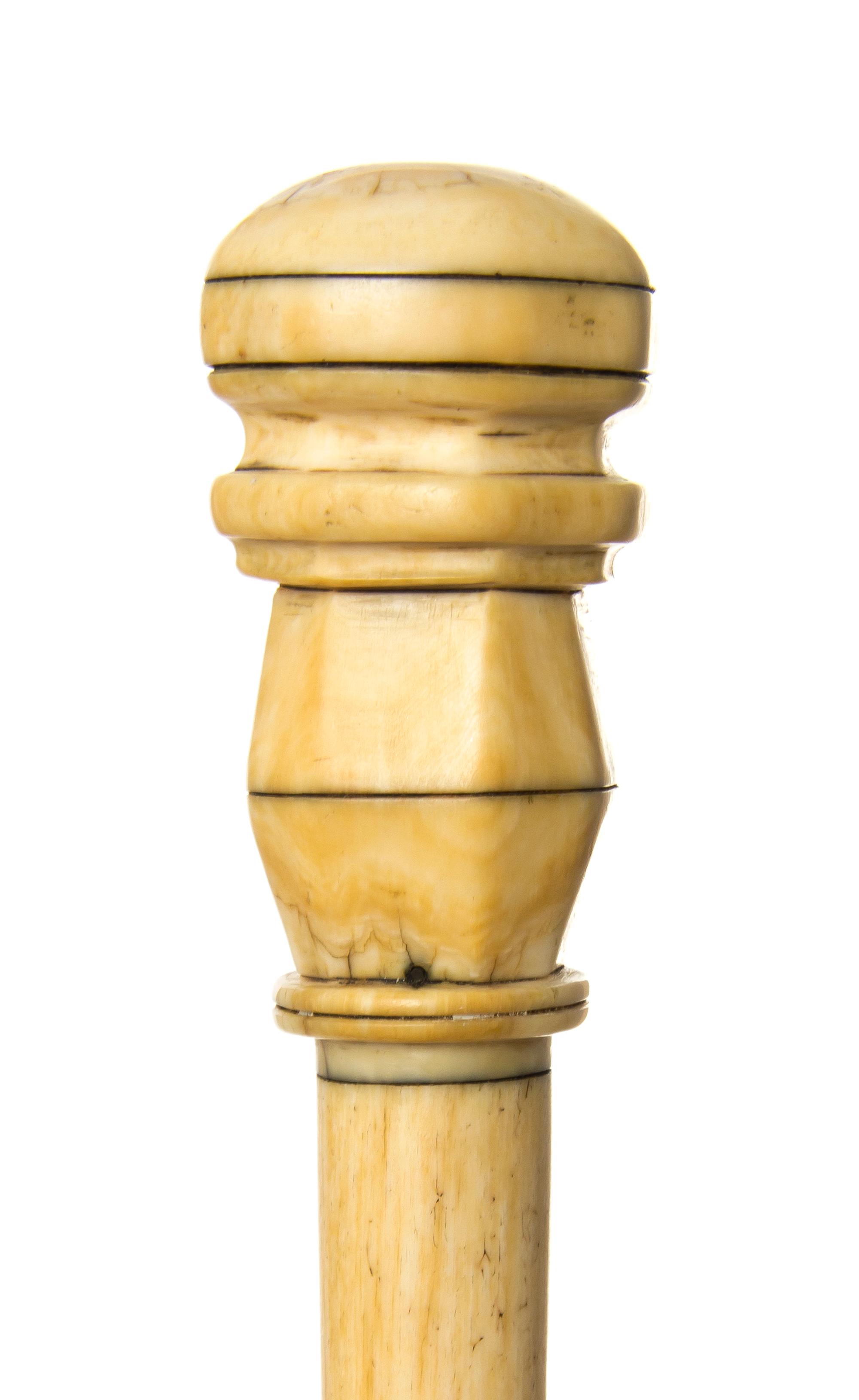 An American Ivory Handled Walking Stick, Length of handle 3 x length overall 34 3/4 inches.