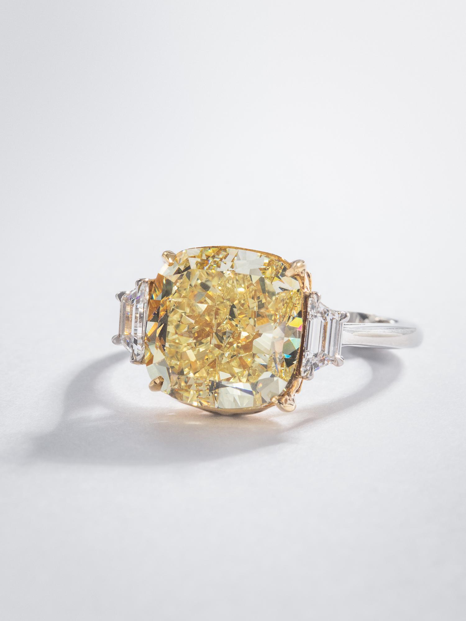 FOREVERMARK, FANCY YELLOW DIAMOND AND DIAMOND RING