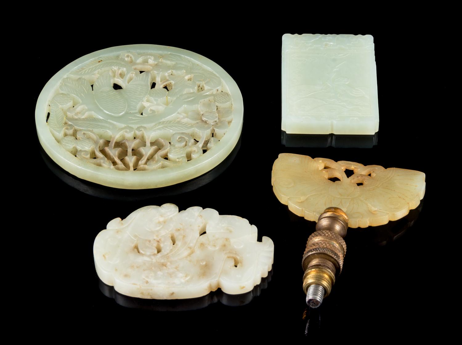 Four Jade Plaques Diameter of larget 3 1/4 inches.