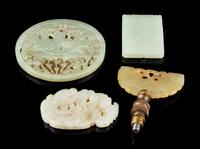Four Jade Plaques Diameter of larget 3 1/4 inches.