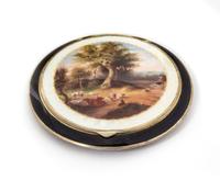 An Austrian Enameled Silver Compact, Vienna, 20th Century, the lid with a guilloche enamel border enclosing a polychrome decorated past