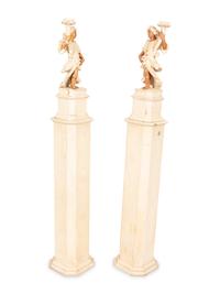 A Pair of Italian Painted Figural Candelsticks on Pedestal Bases