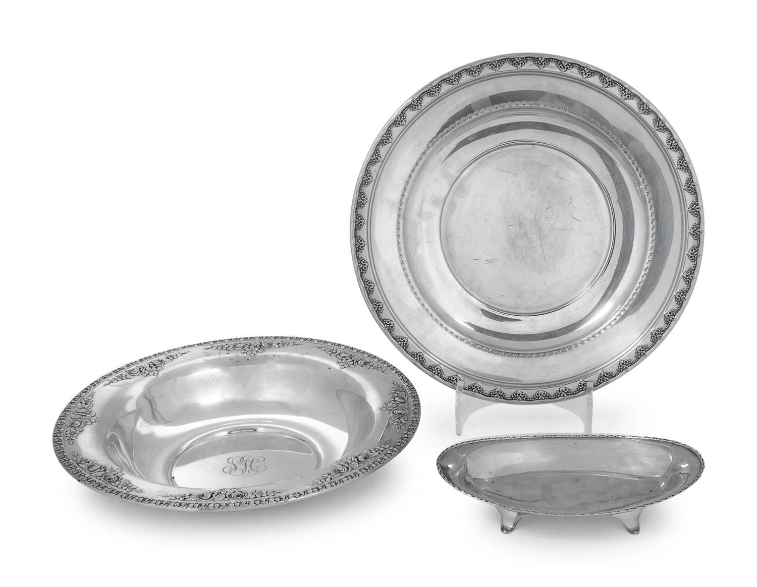 comprising two round platters and a small dish.