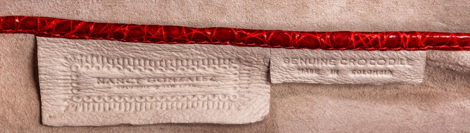 A Nancy Gonzalez Red Crocodile Clutch, 10.75" x 4.5" x 2".