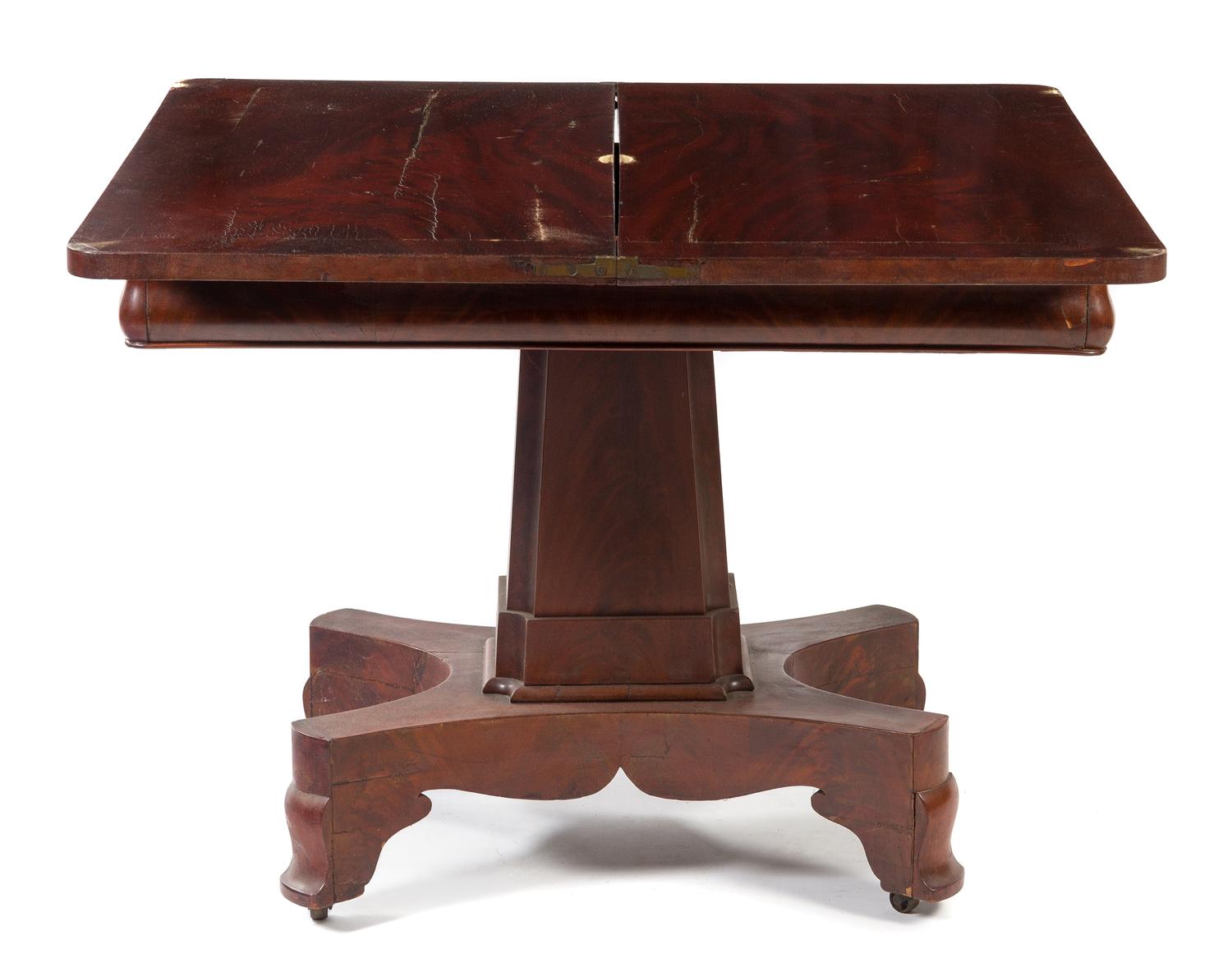 An American Empire Mahogany Flip-Top Game Table Height 28 x width 36 x depth 18 inches (closed). — 19TH CENTURY