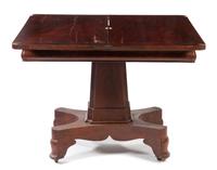 An American Empire Mahogany Flip-Top Game Table Height 28 x width 36 x depth 18 inches (closed). — 19TH CENTURY