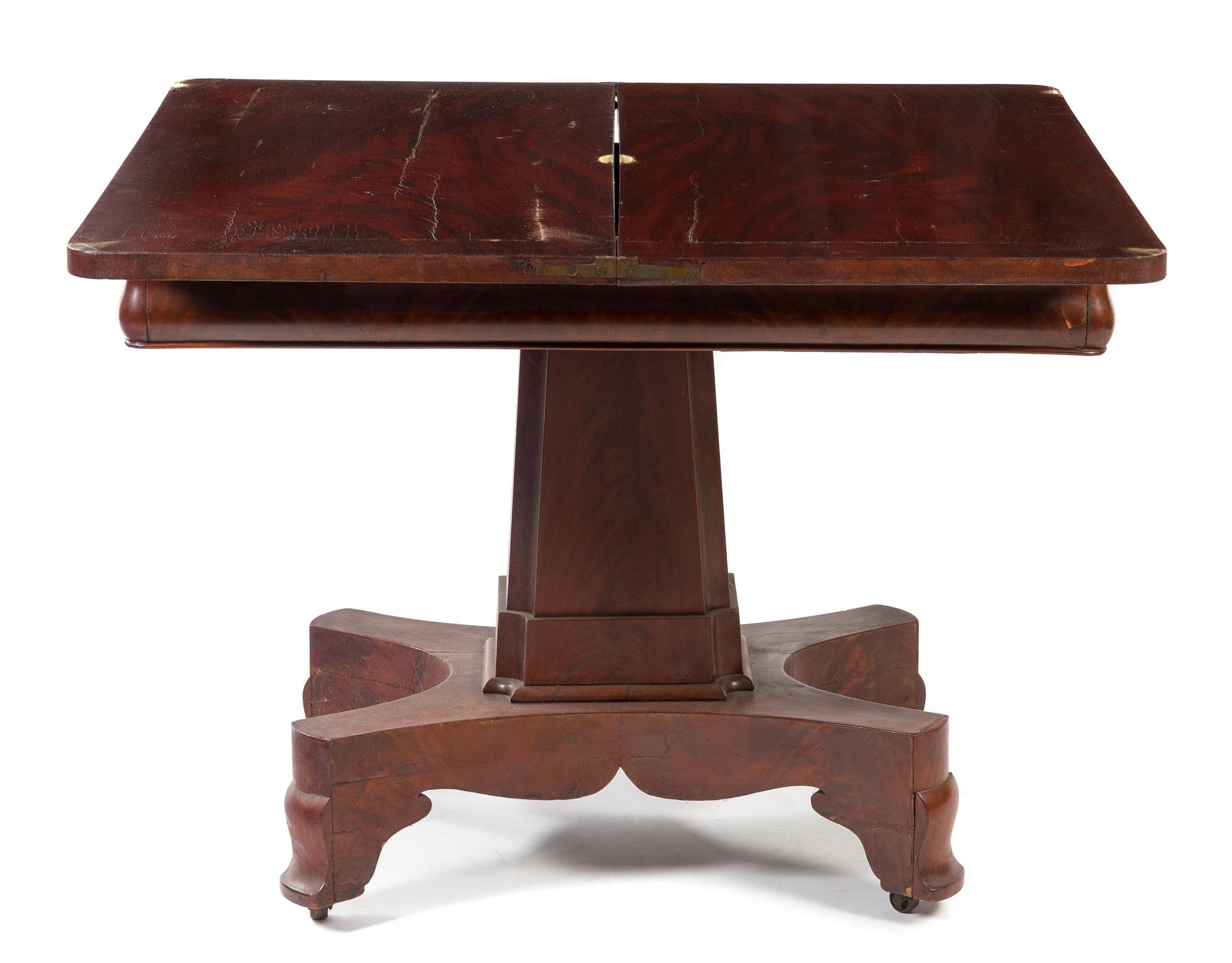 An American Empire Mahogany Flip-Top Game Table Height 28 x width 36 x depth 18 inches (closed). — 19TH CENTURY