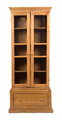 An Irish Pine Bookcase Height 81 x width 42 x depth 17 inches. — 20TH CENTURY