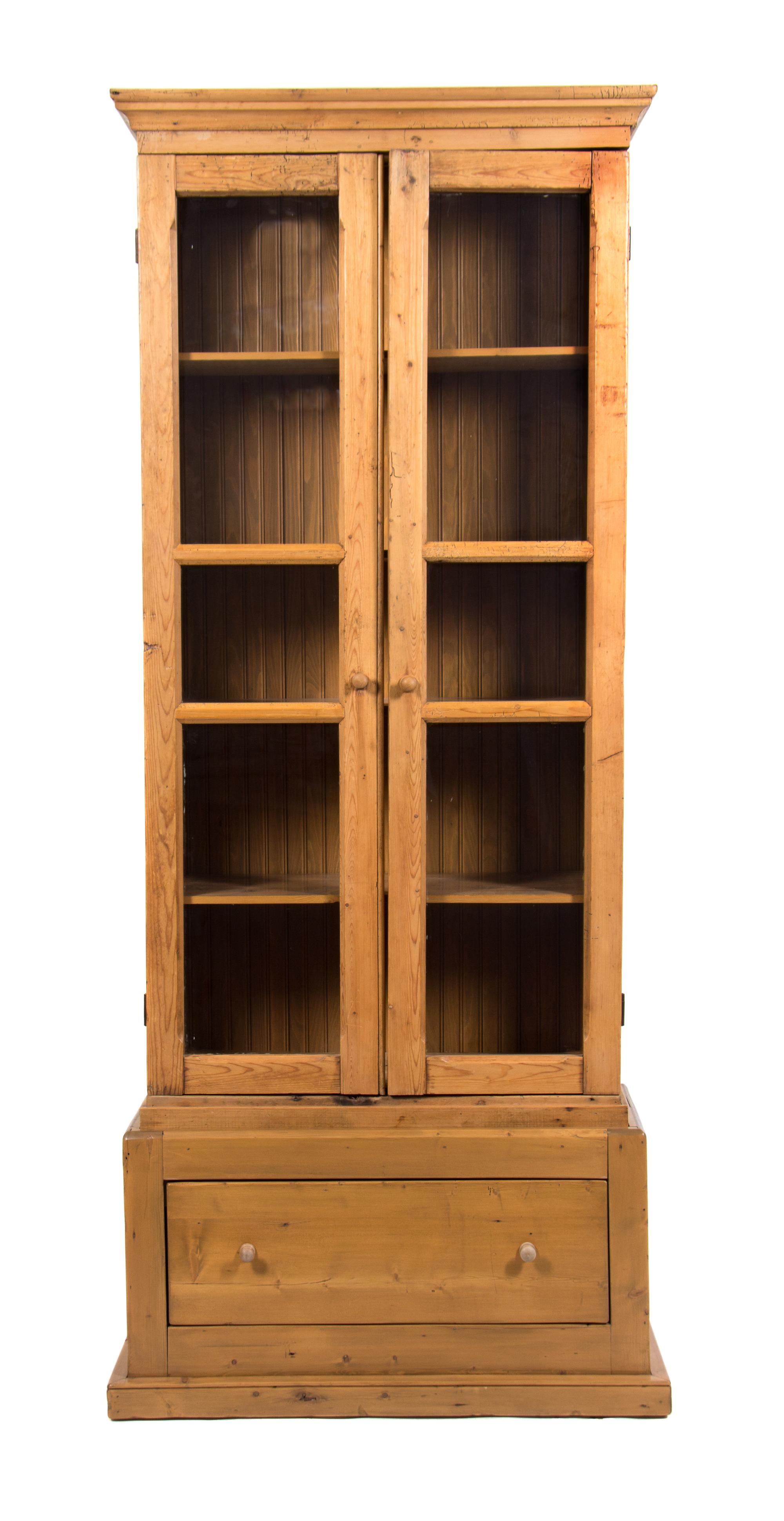 An Irish Pine Bookcase Height 81 x width 42 x depth 17 inches. — 20TH CENTURY