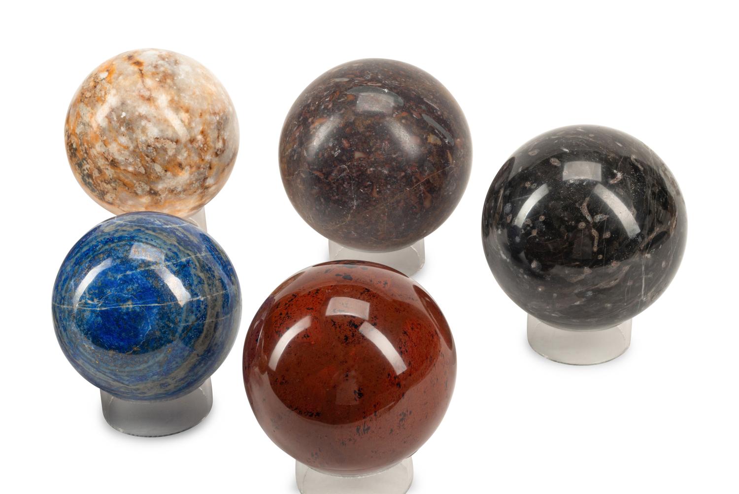 A Set of Nine Specimen Marble Spherical Ornaments