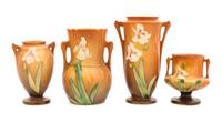 Four Roseville Iris Pottery Vases Heights: 7 1/4, 6 1/4, 5 1/4 and 4 inches.