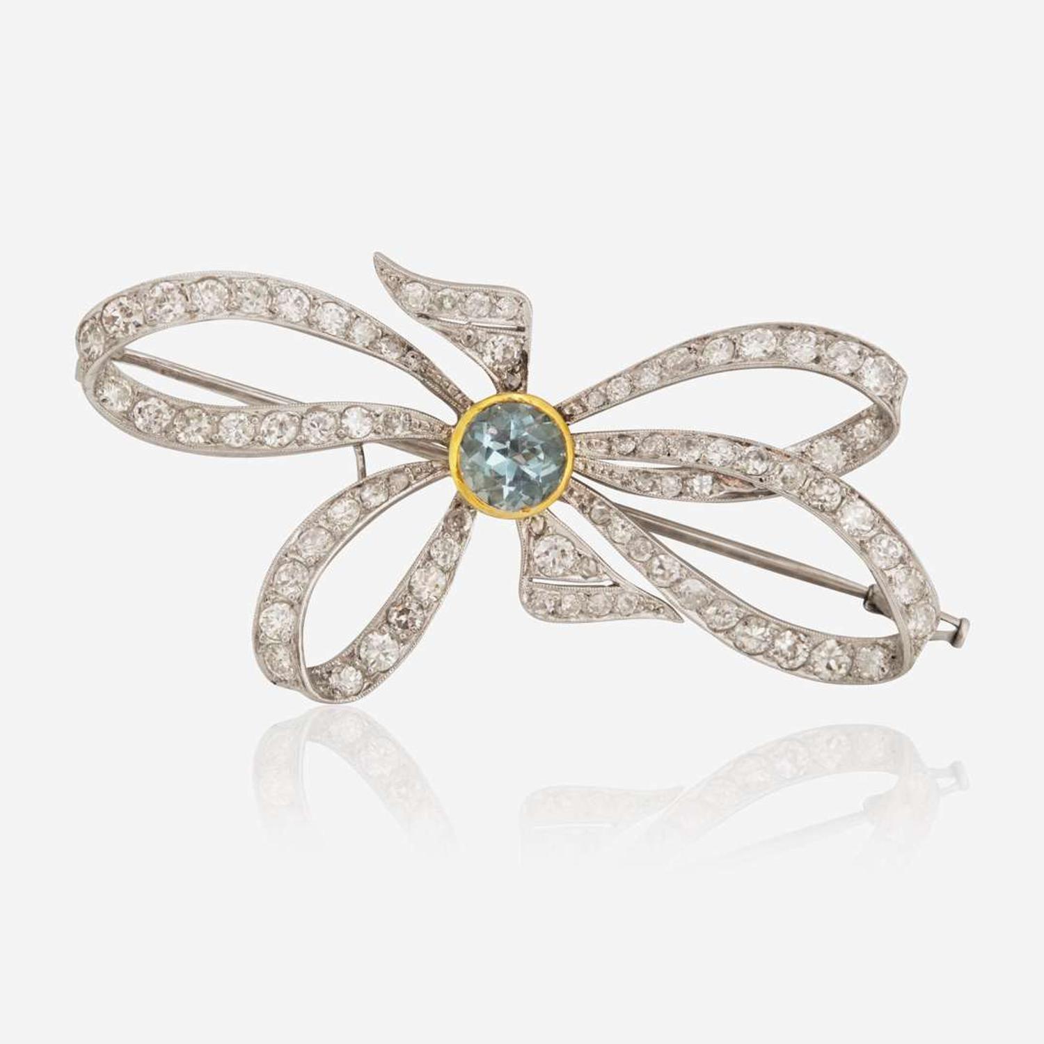A Platinum, Diamond, and Blue Zircon Brooch