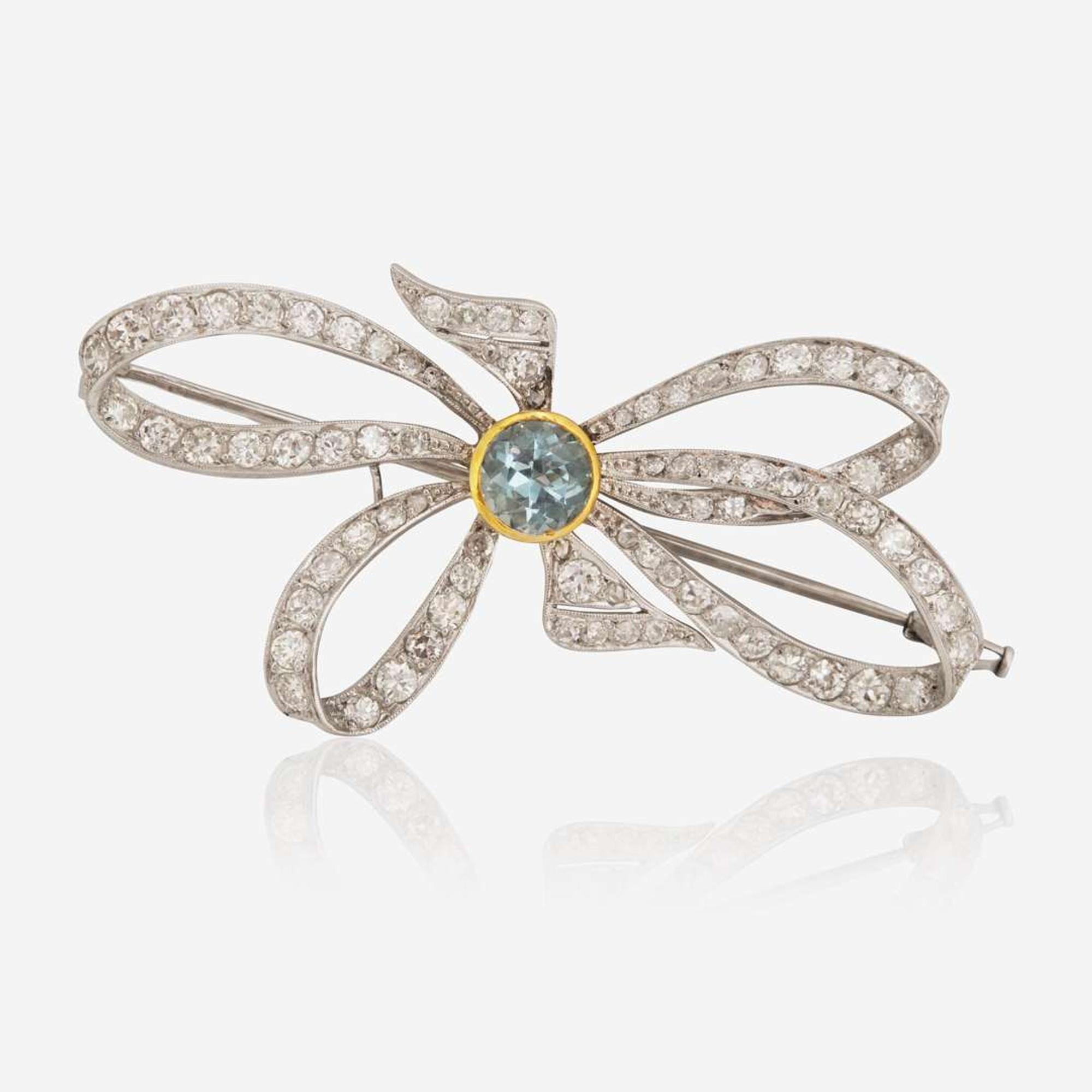 A Platinum, Diamond, and Blue Zircon Brooch