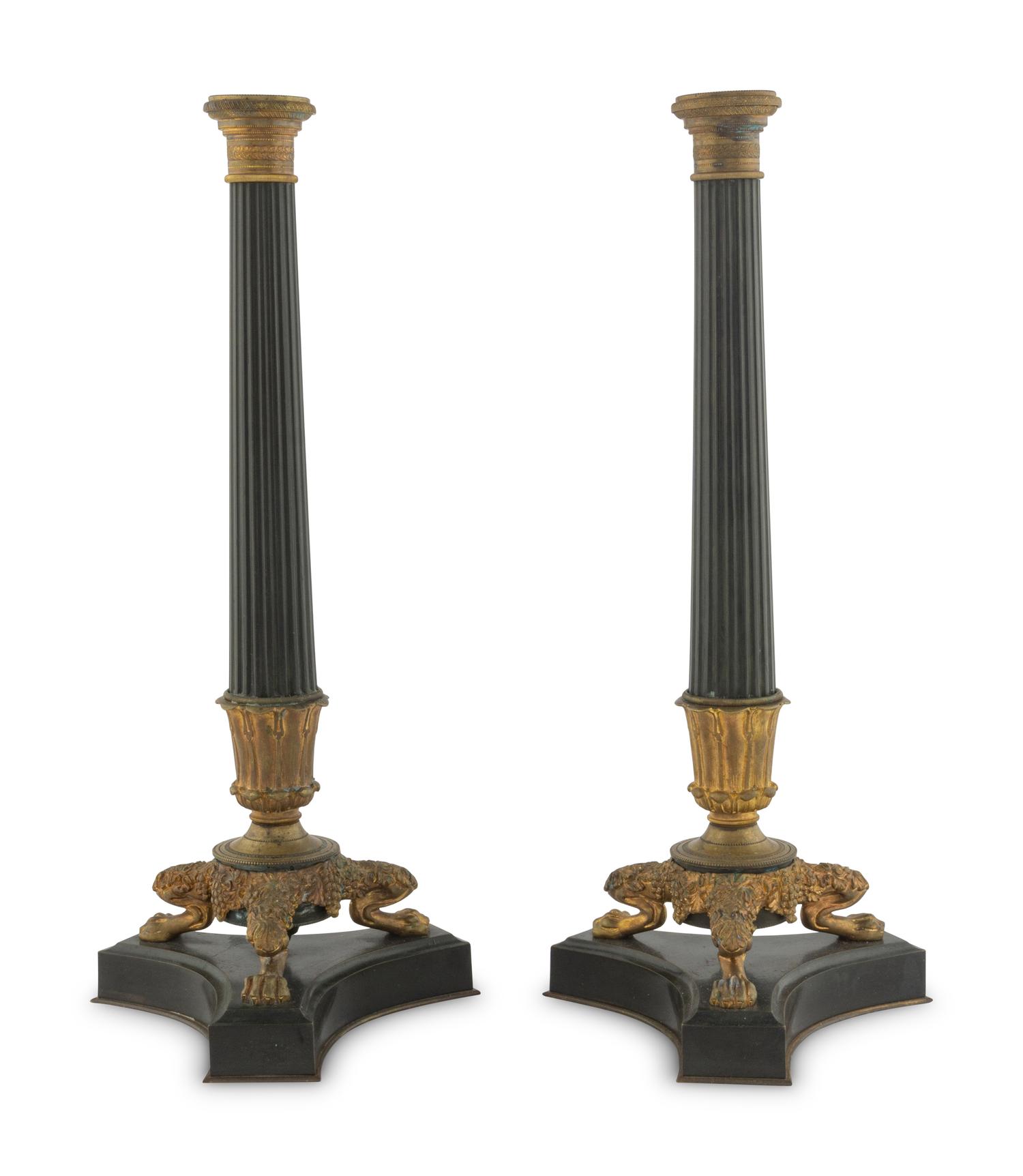 A Pair of Charles X Style Patinated and Gilt Bronze Candlesticks
