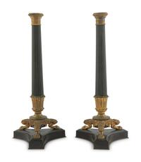 A Pair of Charles X Style Patinated and Gilt Bronze Candlesticks