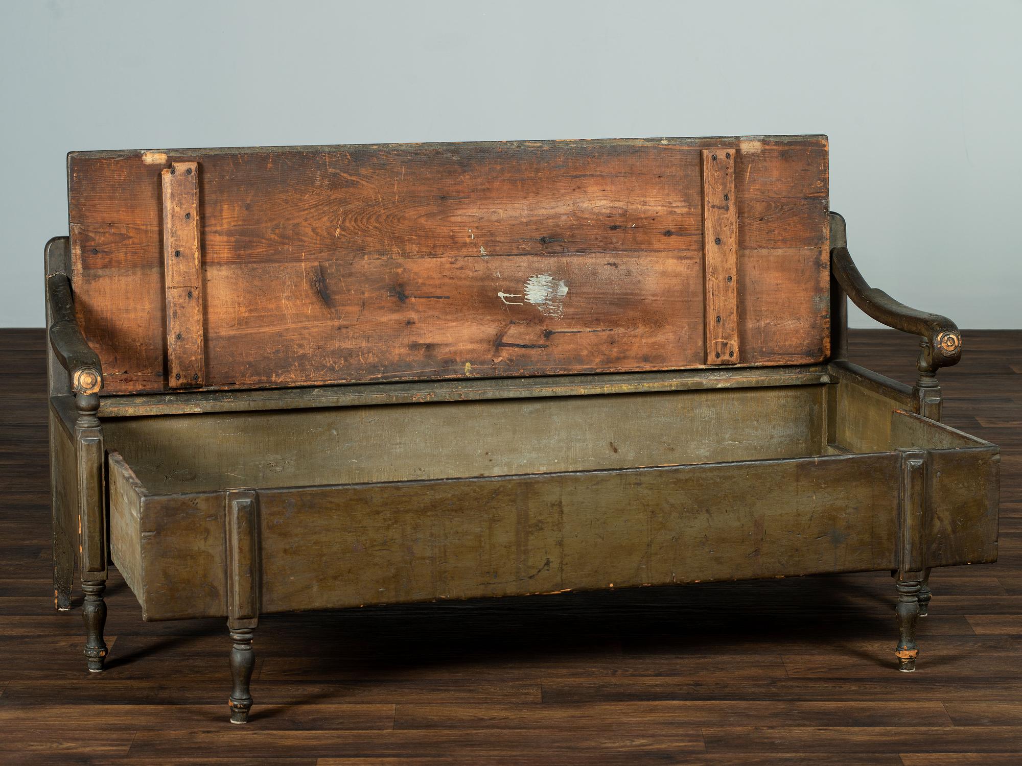 A Swedish-American Green Painted Pine Country Tavern Bench and Trundle Bed