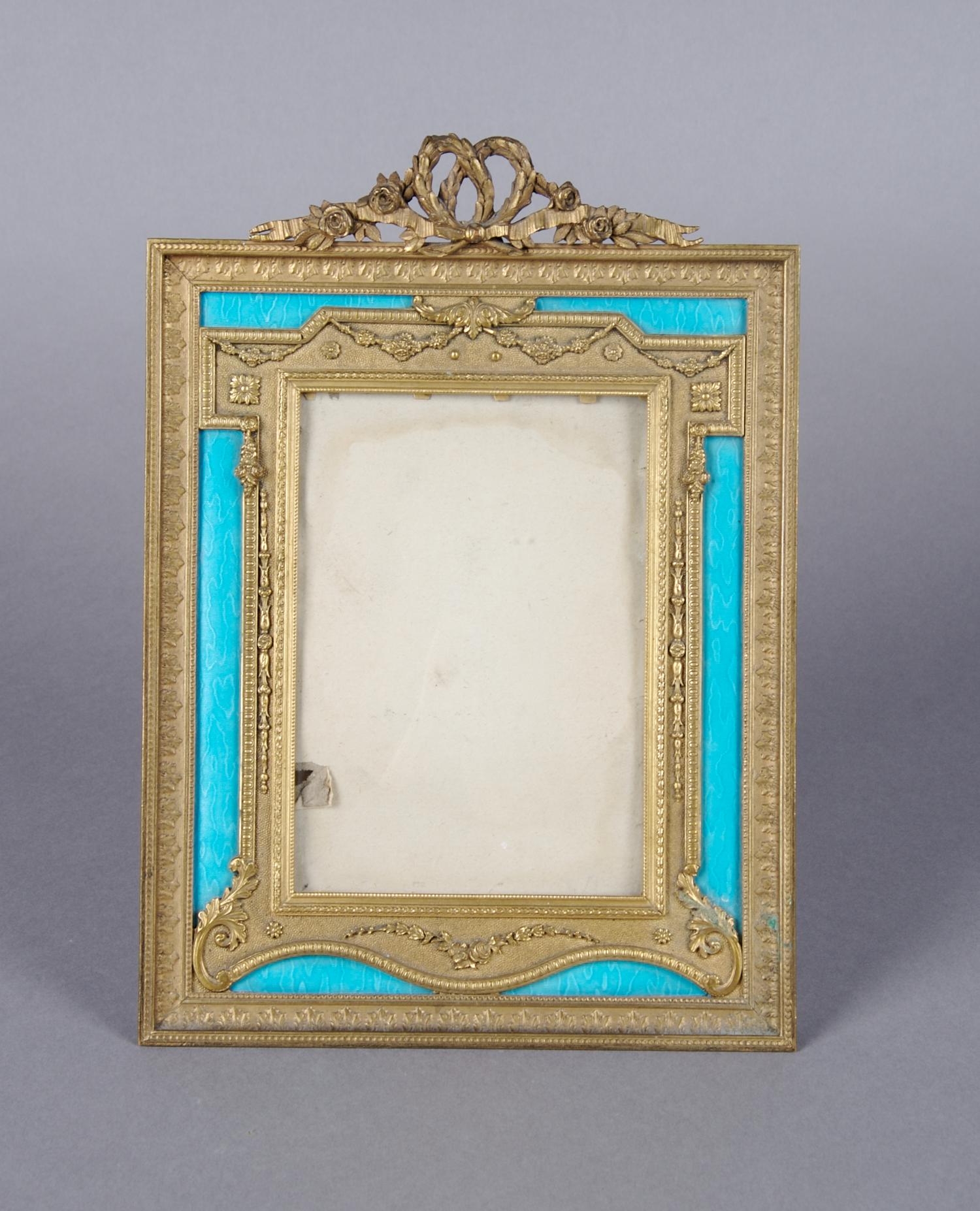 A French Ormolu and Enameled Frame, Height 9 3/4 x width 7 inches.