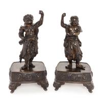 A Pair of Japanese Bronze Guardian-Form Candle Holders Height of each 12 3/4 inches. — MEIJI PERIOD (1868-1912)