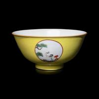 A Chinese Yellow Ground 'Medallion' Porcelain Bowl, Qing Dynasty, 18th Century or Later 清中期 黃地粉彩開光松鶴延年圖碗
