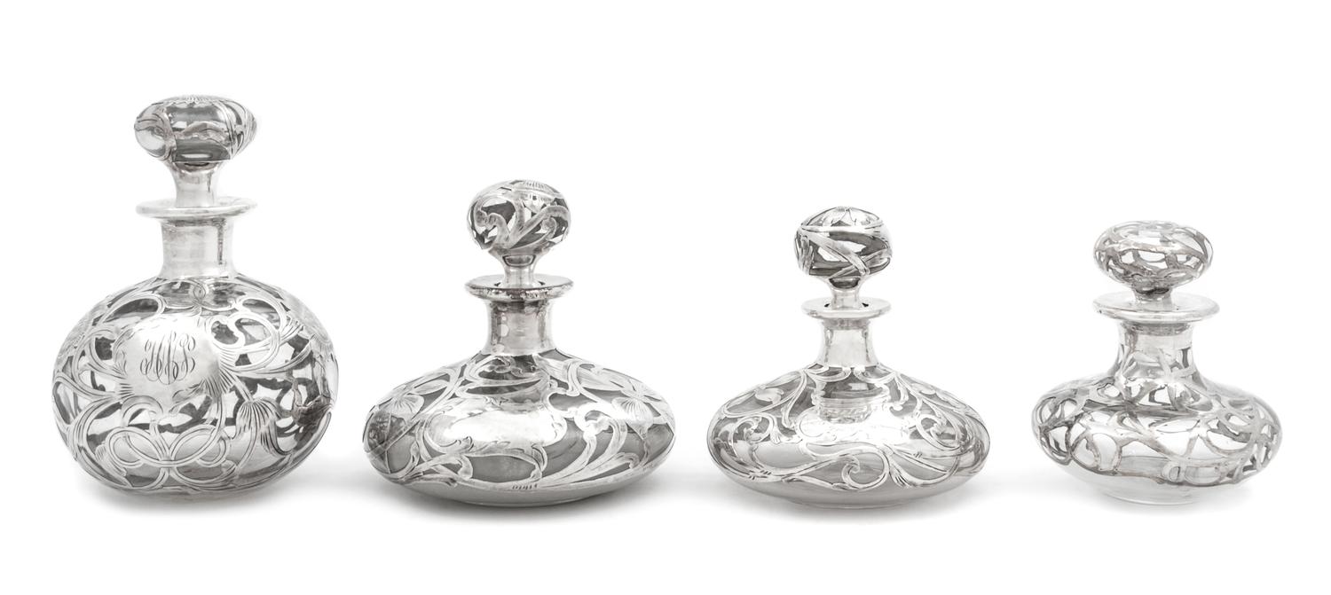 A Group of Four Silver Overlay Glass Scent Bottles Height of tallest 5 3/4 inches.