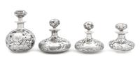 A Group of Four Silver Overlay Glass Scent Bottles Height of tallest 5 3/4 inches.
