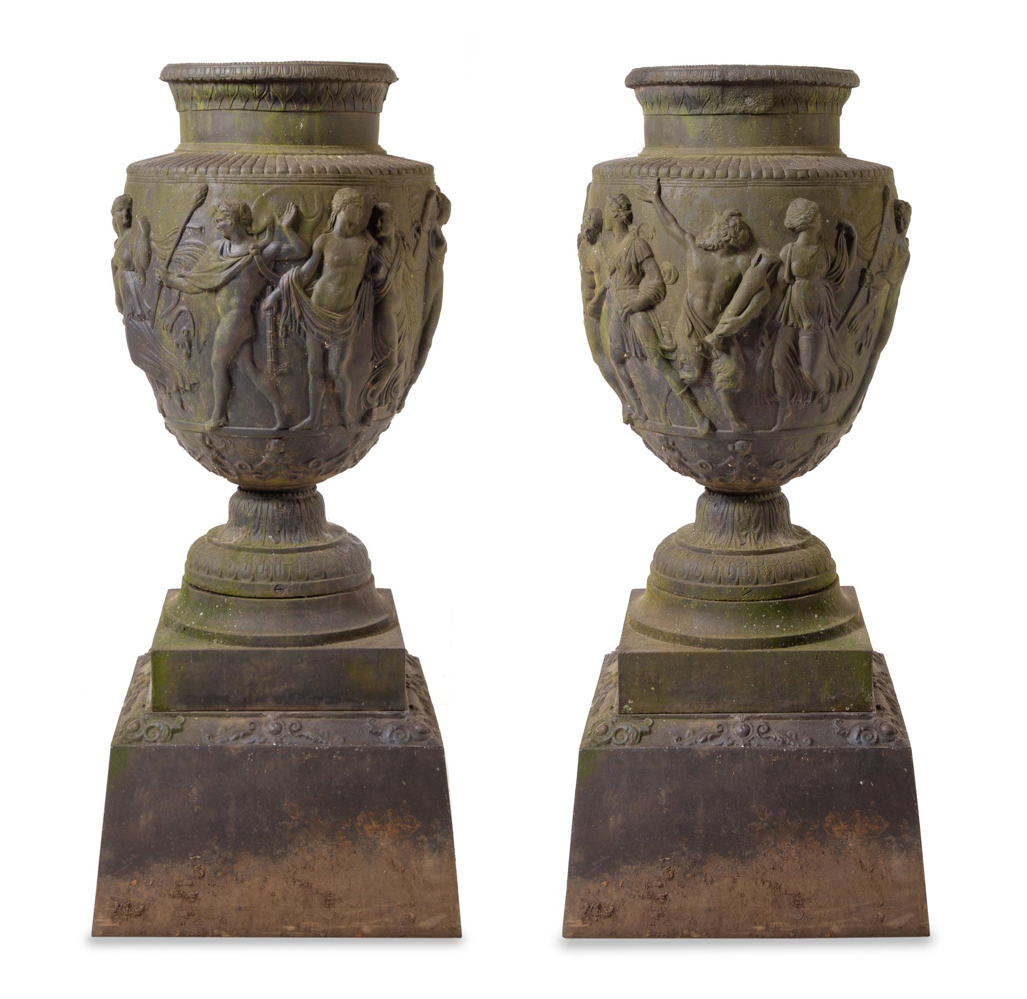 A Pair of Cast Metal Garden Urns Height overall 54 inches. — AFTER THE ANTIQUE, 20TH CENTURY